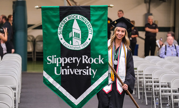 Student walking into graduation