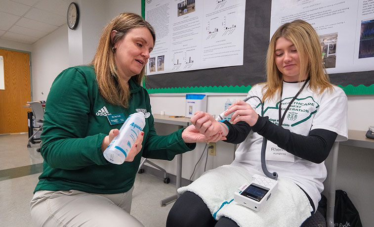 High school student learning about health professions