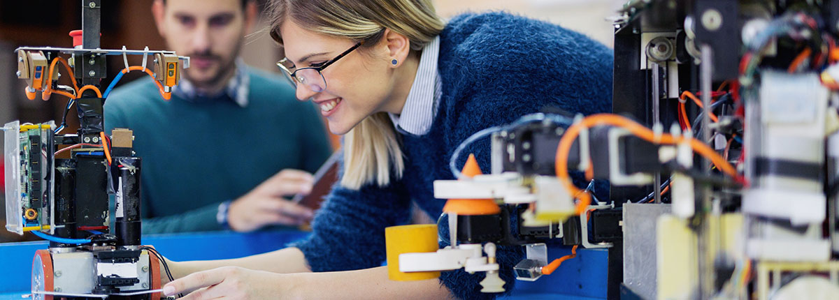 Students working on roboics in an engineering lab 