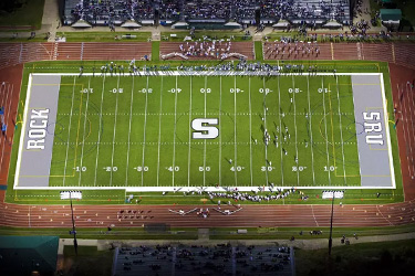 Aerial shot of the Mihalik-Thompson football field at night